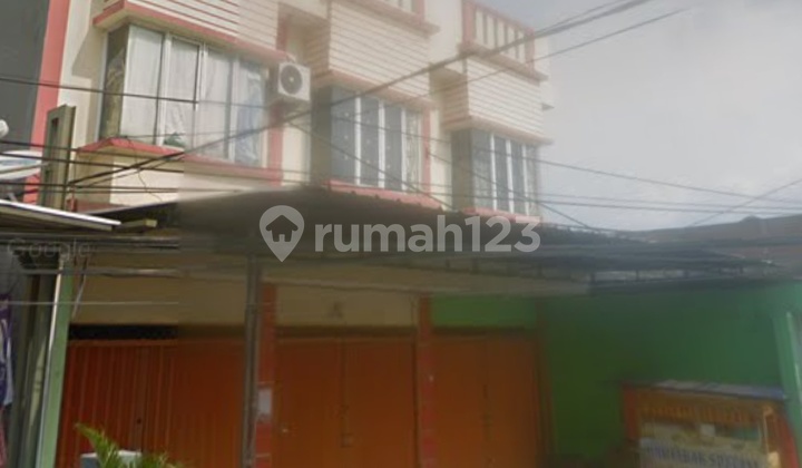 Two-story attached shophouse near Greenlake.