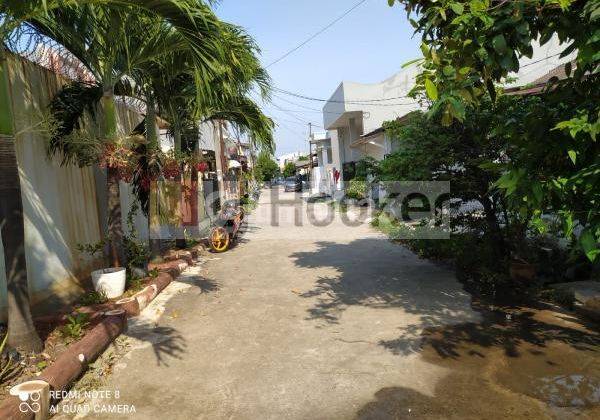 RUMAH SUDAH TINGGI DARI JALAN LOKASI DI PERUMAHAN HARAPAN INDAH 1 AREA BEKASI 2