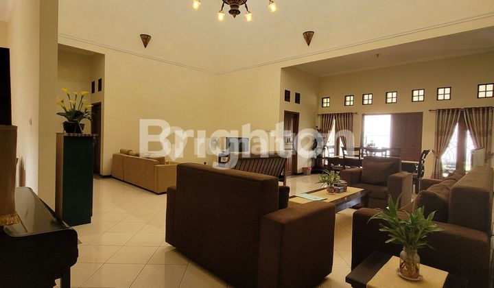 A LUXURIOUS HOUSE WITH A SPACIOUS, LUSH, AND COMFORTABLE YARD, STRATEGICALLY LOCATED IN DEPOK NEAR THE MRT.