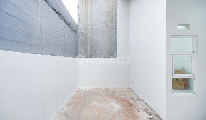 ruang tamu rumah minimalis siap huni di