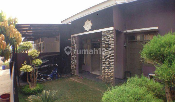 tampak depan rumah cantik murah di villa