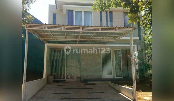 Rumah minimalis tropis ada perabotan bisa KPR di Alam Hijau Citraland, Surabaya 1