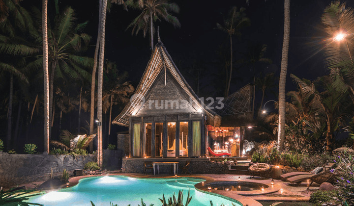 Absolute beachfront Villa with Sumatran style roof 2