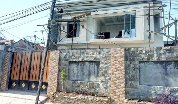 Rumah pinggir jalan hadap Selatan 5KT di Kemanggisan. 15065