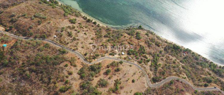 Tanah seluas 23.115 m2, Berada di pinggir jalan raya aspal hotmix, tepat dibukit dengan sunset dan ocean view terbaik 1